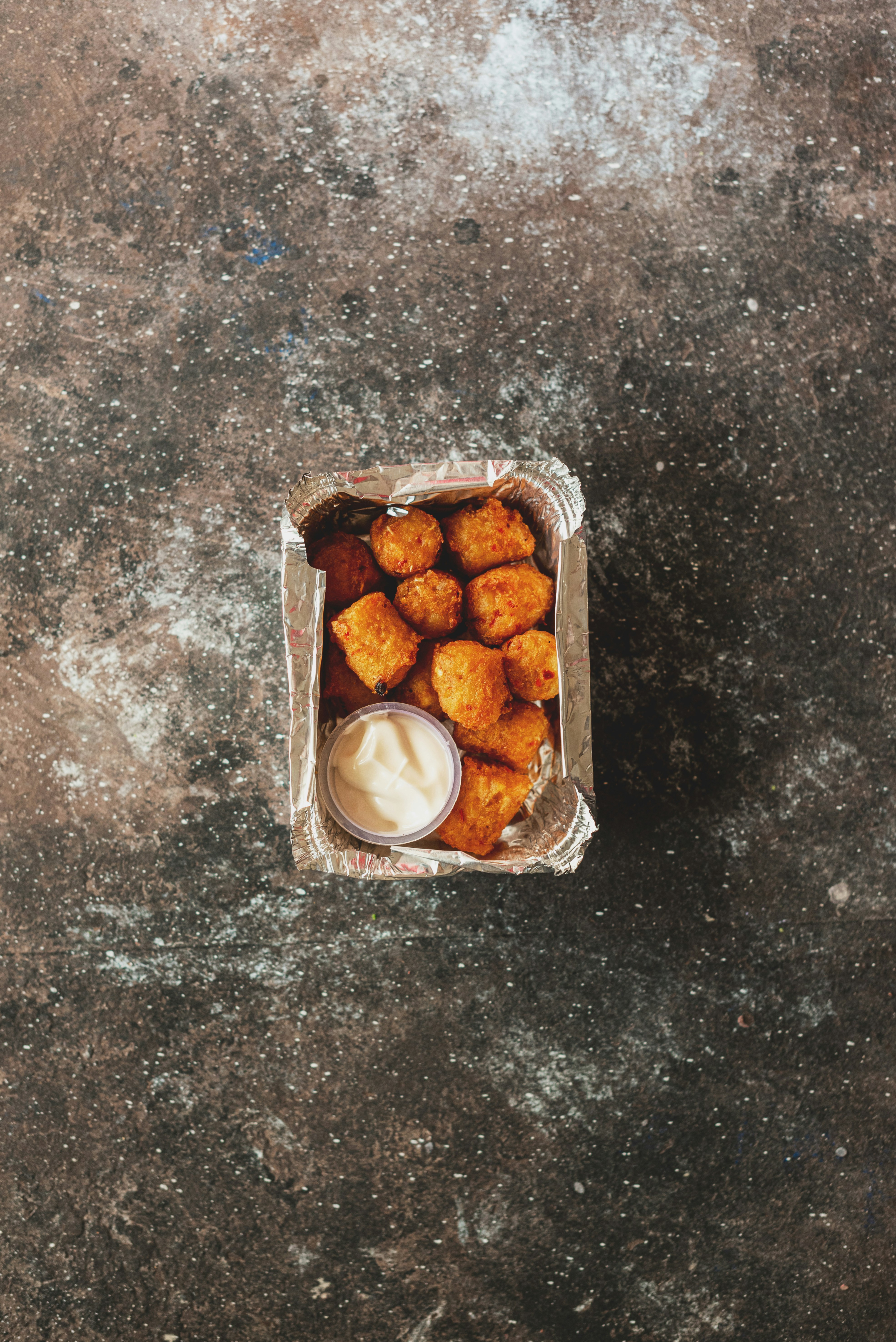 brown round food in clear plastic pack